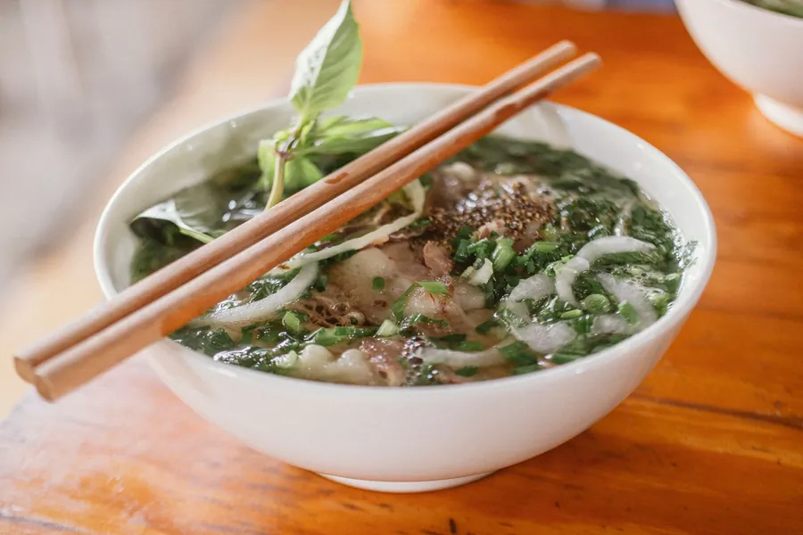 Beef pho with rare steak and herbs